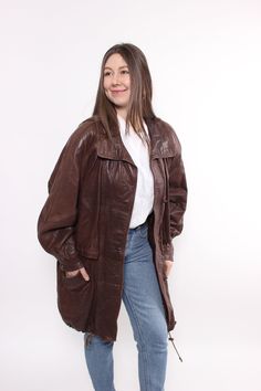 Hi! This is vintage from 90s leather jacket in brown color with buttons closure. This trench coat made of LEATHER.  Model on the photo is 170 cm tall and is wearing a M/L size brown fall trench coat. But, be careful, this is a vintage size, it is better to check the measurements below in the product description. Sleeve - 44cm / 17.32inch;  Width - 65cm / 25.59inch;  Length - 90cm / 35.43inch. All measurements are taken seam to seam while lying flat. Additional photos can be send Wish you a good shopping! FOLLOW US : Instagram:https://www.instagram.com/olena_vintage Welcome to TARASCOMMON.ETSY.COM Retro Oversized Brown Outerwear, Retro Brown Oversized Outerwear, Oversized Brown Leather Outerwear, Vintage Brown Long Coat, Brown Leather Long Coat For Fall, Oversized Vintage Leather Jacket For Fall, 90s Leather Jacket, Fall Trench, Women Trench Coat