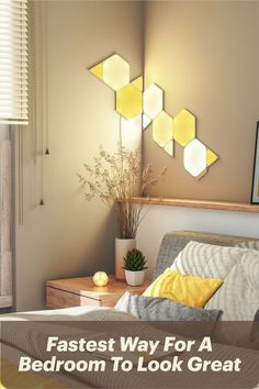 a bed with yellow and gray pillows in a bedroom