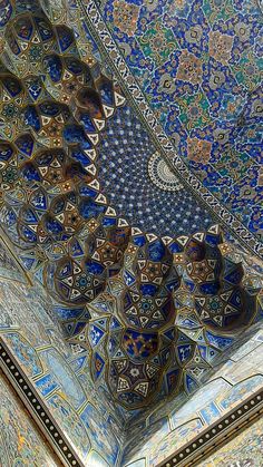 an intricately decorated ceiling with blue and gold tiles