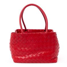 This is an authentic BOTTEGA VENETA Nappa Intrecciato Tote Bag in Red. This shoulder bag is crafted of red nappa intrecciato woven leather in a seamless structure, with interior ties that allow the bag to be worn tucked in or open wide for a weekend getaway tote. The sides areclosed inward and release to a spacious red leather interior. Bottega Veneta Bags, Bag Light, Leather Interior, Weekend Getaway, Hobo Bag, Bottega Veneta, Red Leather, Calf Skin, Bucket Bag