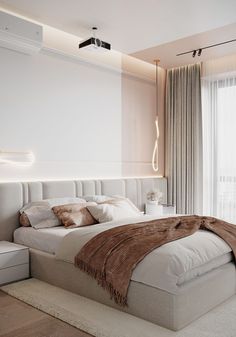 a bedroom with a large bed and white walls