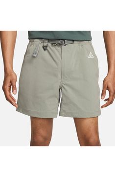 Lightweight, stretchy and ready for adventure, these water-repellent nylon shorts wick away sweat and give you secure pockets for stowing a day's essentials. 6 1/4" inseam; 27" leg opening; 13" front rise; 15" back rise (size Medium) Zip fly with button closure Partial elastic waist Removable belt Front zip pockets; back zip-welt pocket Moisture-wicking fabric engineered for dryness and comfort Water-repellent 96% nylon, 4% spandex Machine wash, tumble dry Imported Nordstrom x Nike: A curated li Nylon Athleisure Cargo Shorts, Nylon Athleisure Shorts With Cargo Pockets, Solid Color Shorts With Functional Drawstring For Outdoor, Solid Shorts With Elastic Waistband For Outdoor Activities, Outdoor Relaxed Fit Moisture-wicking Shorts, Nylon Cargo Shorts With Functional Pockets, Nike Bottoms With Built-in Shorts For Outdoor Activities, Moisture-wicking Athletic Shorts For Summer Hiking, Athletic Shorts With Functional Drawstring For Outdoor Activities