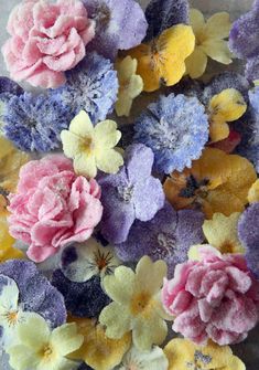 a bunch of flowers that are sitting on a table