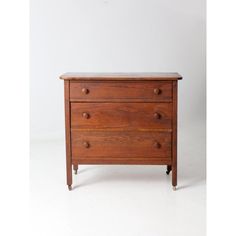 a wooden dresser with two drawers on one side and an open drawer on the other