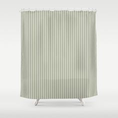 a green shower curtain with white stripes on it