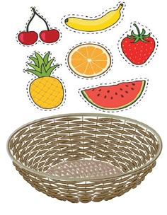 a basket filled with fruit cutouts sitting on top of a table