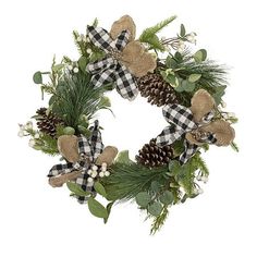 a christmas wreath with pine cones, greenery and burlucks on it