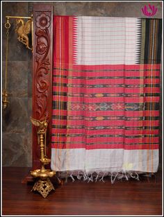 The silk sarees with the top and bottom borders in contrasting colors are called ganga jamuna border sarees. A half white raw silk saree features a natural, textured appearance with two color check patterns on the body and finishes in a detailed pallu with broad stripes and motifs . The red and black ganga jamuna border implies traditional design, where the contrasting colors blend together to create the mesmerizing effect, making it a perfect choice for any occasion. Silk Mark Certified guarant White Traditional Wear With Printed Border, Traditional White Dupatta With Printed Border, White Traditional Wear With Traditional Patterns In Raw Silk, White Traditional Wear With Raw Silk Patterns, White Traditional Wear With Silk Patterns, White Traditional Wear With Printed Border For Festivals, White Dupatta With Traditional Patterns In Raw Silk, White Chanderi Dupatta With Border, White Chanderi Saree With Weaving Work