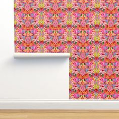 an abstract wallpaper with pink, green and red flowers on it's side