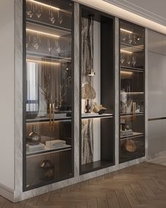 an elegant display case with glass doors in the middle of a room filled with wine glasses and other items