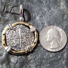 This coin is made from the silver bars recovered from the Atocha. I use moulds from the original coins to get the print. This is a replica but actually made from the silver from the Atocha. The frame around is sterling silver with a 14kt gold overlay and the prongs are sterling silver for an amazing contrast. I use a hammered finish for the frame that gives this piece a beautiful and rich appearance. This is a big, beautiful and statement piece. A true eye-catcher and a stunning piece of history Brass Coin Shaped Jewelry With Large Pendant, Engraved Coin-shaped Amulet Jewelry, Antique Sterling Silver Gold Coin Necklace, Commemorative Coin Pendant Medallion Jewelry, Classic Stamped 14k Coin Jewelry, Antique Gold Sterling Silver Coin Necklace, Commemorative Medallion Coin Pendant Jewelry, Classic 14k Stamped Coin Jewelry, Traditional Gold Jewelry For Commemoration