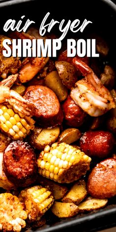 air fryer shrimp boil with corn on the cob and potatoes in a black container