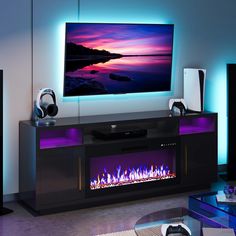 a living room with a large television mounted on the wall next to a fire place