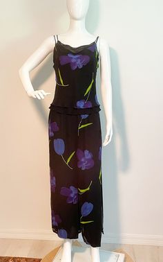 This is a lovely two piece set from Cache.  It includes a double layer spaghetti strap top with cowl neckline.  The pants have the same double layer with the floral print on top giving it the look of a maxi skirt. Flowy and easy to wear, with mix and match potential.  Size tag 4, content tag 100 percent rayon.  No stretch. Measurements taken with pats and top laying flat and doubled where appropriate. In order to determine fit we recommend comparing measurements with an item that fits you well. Top Length 21 inches Underarm to underarm 34 inches Waist 30 inches Pants Length 40 inches Rise 14 inches Inseam 25 inches Waist 24 inches Hips 38 inches  Always happy to answer questions. All sales considered final unless item is grossly misrepresented. Thank you for shopping with us at We Wear Vin Skirt Flowy, Palm Beach Gardens, Beach Gardens, Spaghetti Strap Top, Pant Set, We Wear, Dress Clothes For Women, Palm Beach, Two Piece Pant Set