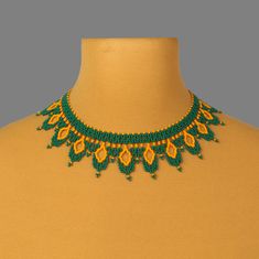 "A green and yellow  bead necklace is a stylish and original decoration. A seed bead necklace will make you more tender and sophisticated. A boho necklace will be a wonderful birthday gift for sister. Despite the size, the beadwork necklace is not heavy.  A boho collar necklace necklace is suitable for any look and is easily combined with clothes of different styles. All beaded jewelry in our assortment is unique. Each product has its own style and original design. Nevertheless, many pieces of jewelry are easily combined with each other, creating an unforgettable image. ------------------ The trendy jewelry is one of the best gift ideas. At SweetBeadsIP, you will find a gift for everyone - gift for girlfriend, gift for mother, gift for sister or gift for daughter. This cute necklace is cra Green Bohemian Choker As A Gift, Green Bohemian Beaded Choker Necklace, Bohemian Green Beaded Choker Necklace, Green Bohemian Choker For Gifts, Bohemian Green Choker As A Gift, Bohemian Green Choker As Gift, Handmade Green Bohemian Choker, Handmade Green Bohemian Beaded Necklaces, Bohemian Green Choker With Colorful Beads