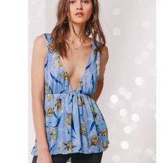 Urban Outfitters Isla Plunging Blue Babydoll Top Floral Never Worn Brand New With Tags Sleeveless Tops By Urban Outfitters For Vacation, Blue Triangle Top Summer Tops, Blue Casual Triangle Top, Casual Blue Triangle Top, Blue Triangle Casual Top, Casual Floral Print Triangle Top, Urban Outfitters Tops With Floral Print For Day Out, Blue Beach Tops By Urban Outfitters, Blue Summer Tops From Urban Outfitters