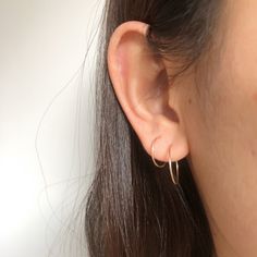 "Simple small dainty hoop earrings, made from from wire. Every single piece is handmade so it might slightly look different from each other. 1 PAIR Thickness: 20 gauge/0.8mm Material & color: 1. Copper plated wire, nickel free 2. Sterling silver, 14k Gold filled and 14k Rose gold filled Choose your options Size 14mm/0.55\" Size 17mm/0.67\" Mixed, 1piece 14mm and 1piece 17mm When putting them on please take your time, give a slight twist and ease through pierce hook into the eye loop and secu Tiny Hoop Huggie Earrings Minimalist Style, Minimalist Small Hoop Single Earring, Tiny Delicate Hoop Jewelry, Delicate Tiny Hoop Jewelry, Delicate Tiny Yellow Gold Hoop Earrings, Simple Small Hoop Earrings For Pierced Ears, Tiny Small Hoop Cartilage Earrings For Everyday, Small Hoop Huggie Earrings With Simple Design, Dainty Hoop Earrings With Simple Design For Everyday