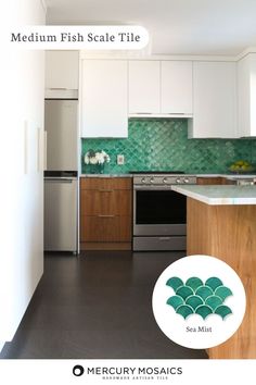 a kitchen with white cabinets and green tile backsplash