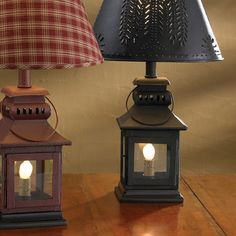 two lamps sitting next to each other on a table