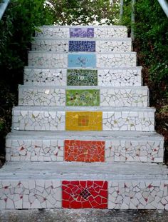 the steps are painted with different colors and designs on them, all made out of tiles