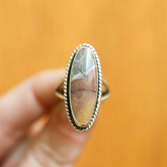 What is your favorite Jasper? Good luck! The more you get to know them the more beautiful they are. These Sonora Jasper Boho rings are Ready to Ship. Choose your size from the drop-down below. The LBJ Sonora Jasper Boho Ring looks and feels like it could have been made by a master silversmith from another time and place. Simple, classic design with the .925 Sterling Silver twist wire and comfy split shank. It makes you feel like you're sliding on something that someone will still wear in 50 year Silversmith Rings, Big Statement Rings, Opal Drop Earrings, Peruvian Blue Opal, Jasper Ring, Mabe Pearl, Boho Pendant, What Is Your Favorite, Gold Bracelet Cuff