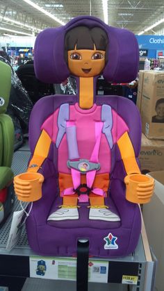 the child's car seat is purple and has an image of dora on it