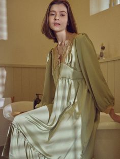 Editor's Notes The dress pajamas give a luxurious mood with smooth, glowy satin fabric and lace. - V-neckline to accentuate the neck- Delicate lace on the neckline- Floral patterned lace- Feminine fit that wraps to the body- Shirring on shoulders and chestMeasurements(in.)M / L- Length: 44.09 in. / 45.07 in.- Shoulder: 12.99 in. / 13.97 in. - Chest: 18.11 in. / 19.09 in.- Sleeve: 22.04 in. / 22.53 in.Model info: Lira - Height 5' 7'', Fitting size M / Anastasia - Height 5' 8'', Fit Luxury Feminine Delicate Lace Sleepwear, Elegant Spring Dresses For Pajama Party, Spring Satin Sleepwear With Lace Trim, Feminine Long Sleeve Satin Sleepwear, Satin Nightgown With Lace Trim For Loungewear, Satin Dresses With Lace Trim For Sleep, Satin Nightgown With Lace Trim For Sleep, Satin Long Sleeve Sleep Dress, Long Sleeve Satin Sleep Dress