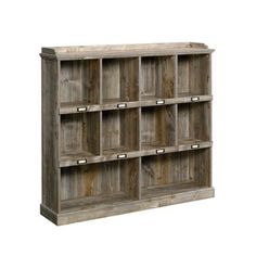 an old wooden shelf with many compartments