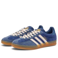 Find ADIDAS Gazelle Indoor on Editorialist. An indoor training shoe originally released in ’79, the adidas Gazelle Indoor has certainly stood the test of time. This time round, they come presented in hairy blue suede on the upper, accented with white through the laces and the all-important 3-Stripes. A translucent gum rubber sole sits underfoot, rounding off the style with a retro touch. Suede Upper, Lace Up Closure, Gum Sole, Adidas. Adidas Gazelle Indoor in Dark Blue/Bliss Orange/Preloved Ink, Adidas Gazelle Navy, Tan Outfits, Gazelle Shoes, Adidas Gazelle Indoor, Perfect Dark, Cute Sneakers, Shoe Inspo, Swag Shoes, Retro Sneakers