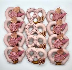 doughnuts decorated with flowers and seashells on white background