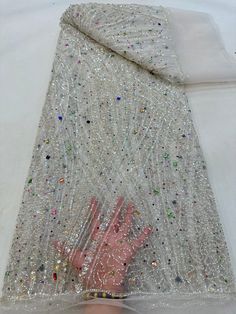 This high quality Fabric is measured in 5 Yards With Embroidered Beading and Sequin. It is soft, very delicate and beautiful. This high Quality Fabric is made with Fashion embroidered rhinestones can be used in making party wedding dresses, skirts, shawls, scarves and other other fashion apparels as you would like. Size : Length : 5 yards (180 inch). Width: 50 inch (Please allow slight deviation for the measurement data ,±1 inch) Material: 100% Polyester, Tulle Lace Fabric, Eco-Friendly embroide Beaded Lace Fabric, Luxury Fabric, Glitter Fabric, Sequin Beading, French Lace, Tulle Lace, Beaded Lace, Wedding Party Dresses, Fashion Fabric