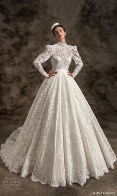 a woman in a white wedding dress with long sleeves and lace on the skirt is posing for