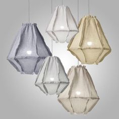 five different colored lamps hanging from strings