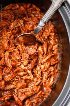 the food is being prepared and ready to be cooked in the pot with tongs