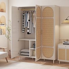 an open wardrobe with clothes hanging on it