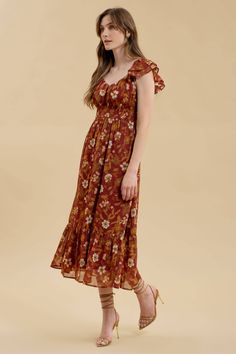 Step into end of summer and autumn with our enchanting Fall Floral Dress, a perfect blend of playful elegance and bohemian charm. This dress captures the essence of fall with its beautiful dark red hue and earthy floral print, ensuring you stay stylish and confident for any occasion. Embrace the season with our feminine Fall Floral Dress, featuring a sweetheart neckline, double ruffle sleeves, and a ruffled hem that adds a whimsical touch. The ruched bust and smocked underbust provide a flatteri Casual Midi Dress With Ruffled Fitted Bodice, Flowy Smocked Dress With Ruffles And Empire Waist, Bohemian Dress With Smocked Bodice And Ruffled Straps, Casual Midi Dress With Sweetheart Neckline And Ruched Detail, Fitted Midi Dress With Smocked Bodice And Ruffled Straps, Casual Ruffle Dress With Sweetheart Neckline, Fitted Brown Smocked Dress With Ruffles, Brown Square Neck Dresses With Ruffles, Brown Square Neck Dress With Smocked Back