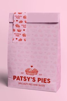 a pink paper bag with red and white designs on it, that says patsy's pies specialty pies and slices