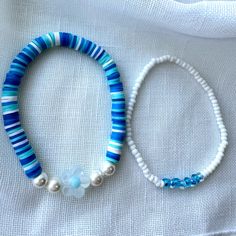 Beautiful Handmade Stretch Bracelets In Blues And White. 6.5-7”. Heisha Bracelet Has Flower Charm. Seed Bead Bracelet Is In White And Blue. Colors May Vary Due To Screen Or Monitor Settings Items Usually Shipped Within 24 Hours M-F. Sat Before Noon. Items Packaged And Shipped With Care. Price Is For Both Bracelets. Take A Look At My Other Bracelet Listings And Bundle For 10% Discount. Small Bead Bracelet, Jewelry Sets Handmade, Wrist Stacks, Seed Bead Bracelet, Bracelets Handmade Beaded, Seed Bead Bracelets, Bead Jewelry, Seed Bead Jewelry, Beaded Stretch Bracelet