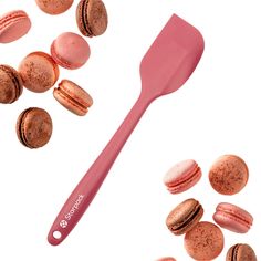 macaroons and a pink spatula on a white background