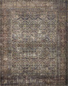 an antique rug with many different colors and patterns