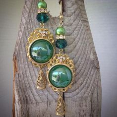 These pretty earrings are made using emerald green cabochons , brass filigree and glass pearls Pearl Ball Earrings, Yellow Flower Necklace, Penny Necklace, Green Tassel Earrings, Repurposed Necklace, Assemblage Earrings, Emerald Green Earrings, Brass Filigree, Cameo Earrings