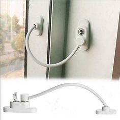 an image of a white door handle with two plugs attached to the side of it