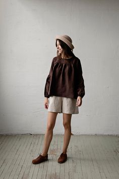 "Victorian tunic is made from 100% soft and washed linen.  Details: - Colour: Chocolate - Composition: 100% Oeko-Tex certified linen - Grey ribbon in the back - Ruffled long sleeves - Medium weight linen - Linen care: machine wash gentle; tumble dry low, ironing optional - The price is for one tunic, other pictured items are not included The model is 170 cm/5'7\" and wears a size S." Brown Linen Long Sleeve Blouse, Long Sleeve Linen Peasant Top For Daywear, Brown Linen Blouse For Spring, Spring Brown Linen Blouse, Peasant Long Sleeve Linen Tops, Peasant Style Long Sleeve Linen Top, Long Sleeve Linen Peasant Top, Peasant Linen Tops For Daywear, Relaxed Fit Ramie Blouse For Daywear