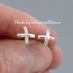 Say it all with these gorgeous little Kiss cross earrings, 0.8 cm and hand-crafted in 925 sterling silver. We have many more earrings in our shop, all unique to LaGrangeBijoux, some quirky, some romantic, many reflecting nature's beauty, please do explore our shop further https://www.etsy.com/shop/LaGrangeBijoux?section_id=16396181&ref=shopsection_leftnav_2 All our items are delivered in a presentation box and all packaging is included in the shipping. All items are sent using the French La Post Cross Stud Earrings, Cross Earrings Studs, Cross Earrings, Jewelry Earrings Studs, Hand Crafted, Presentation, Handmade Items, Jewelry Earrings, Kiss