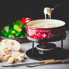 a bowl of soup is being poured into it