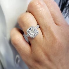 This exceptional diamond engagement features a GIA certified 3.00 Ct. Cushion cut diamond with I color grade and very clean VVS1 clarity. Matching its color and clarity are 0.70 Ct. Round cut diamonds set pave on the halo and flow down the shank in a single row. Matching Band is available by request! Metal : 14K Gold, 18K Gold or Platinum Setting Type : Prong, U-Setting Total Carat Weight : 3.70 Carats Type : Natural Diamond Shape : Cushion Cut Carat Weight : 3.00 Ct. (GIA Certified) GIA Certifi Gia Certified Diamond White Diamond Ring, Gia Certified Dazzling Diamond White Diamond Ring, Gia Certified Dazzling White Diamond Ring, Dazzling Gia Certified Diamond White Diamond Ring, Radiant Cut Diamond Ring With Vvs Clarity, Vvs Clarity Radiant Cut Diamond Ring, Elegant Radiant Cut Diamond Ring Gia Certified, Gia Certified Diamond Ring In Fine Jewelry Style, Gia Certified Moissanite Diamond Ring For Proposal