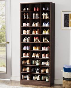 the shoe rack is filled with many pairs of shoes