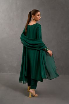 SKU: 1025 Price for Shirt and inner only.Amongst the deepest shade of green this stunning creation is crafted using the finest raw silk adorned with beautiful French knots work further garnished with lovely pearls and sequins. Paired with a same-toned dupatta to complete the look. Green Silk Formal Set, Formal Green Dupatta With Dabka Detail, Elegant Green Sets With Dabka, Green Formal Salwar Kameez For Festive Occasions, Formal Festive Green Salwar Kameez, Formal Green Set With Mirror Work, Elegant Green Traditional Wear For Festive Season, Elegant Green Festive Traditional Wear, Elegant Green Chanderi Traditional Wear