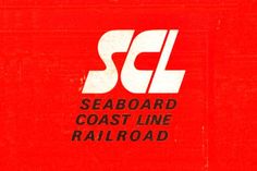 a red sign with the words seaboard coast line railroad on it's side