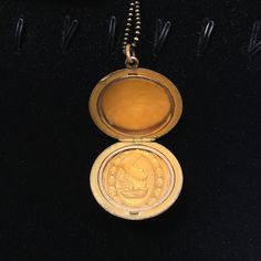 "This elegant Art Deco gold filled locket features a finely sculpted profile of a lovely lady surrounded by an oval ring of dark glittering paste stones and another ring of interesting engravings. The back of the locket has the initials \"RB\" engraved in Edwardian-style lettering. Inside, you can see the letters \"C, Q, and R\" in a small triangle which indicates the jewelry company who crafted this locket was the esteemed Carter, Qvarnstrom, & Remington of Attleboro, MA (they produced lock Bronze Vintage Charm Jewelry For Anniversary, Bronze Jewelry With Vintage Charm For Anniversary, Elegant Cameo Jewelry Keepsake, Antique 14k Stamped Locket Necklace Collectible, Vintage 14k Gold Jewelry For Memorial, Elegant Cameo Keepsake Jewelry, Elegant Bronze Round Locket Necklace, Bronze Locket Jewelry For Anniversary, Antique Gold 14k Stamped Jewelry As Gift